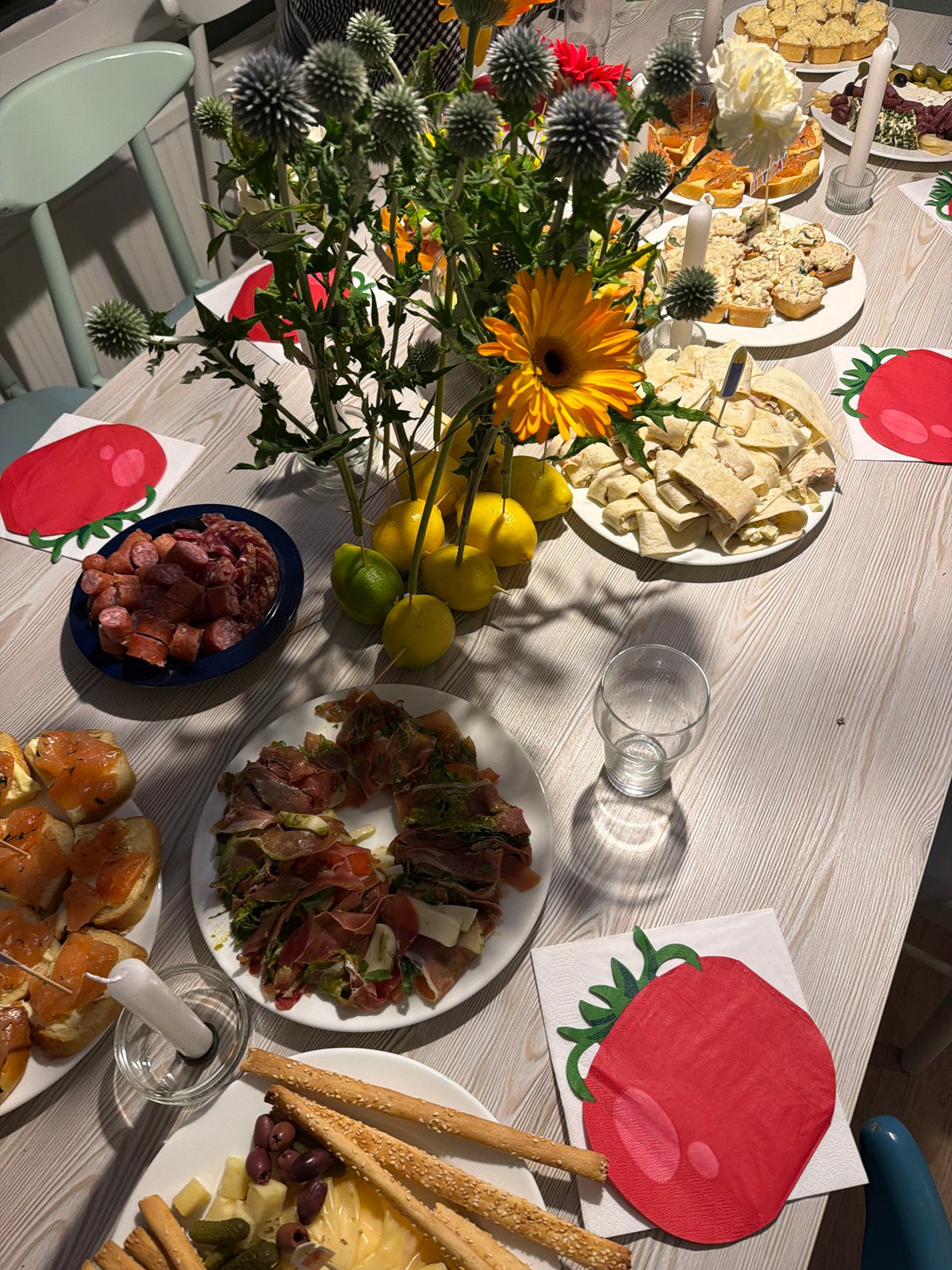 Birthday party in Heijen with food, flowers, and a cow costume