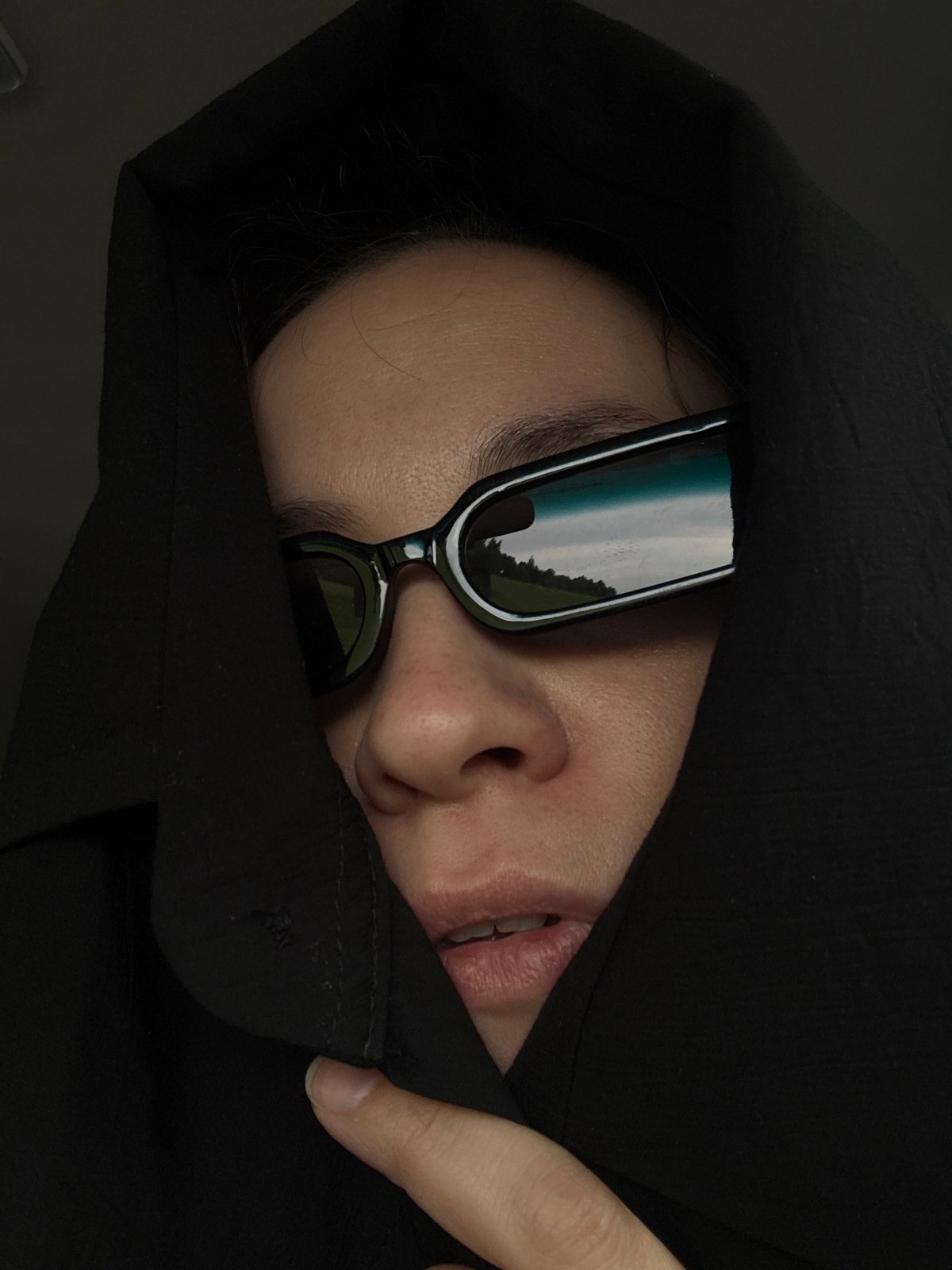 Person in dark attire spotted resting in Russian village