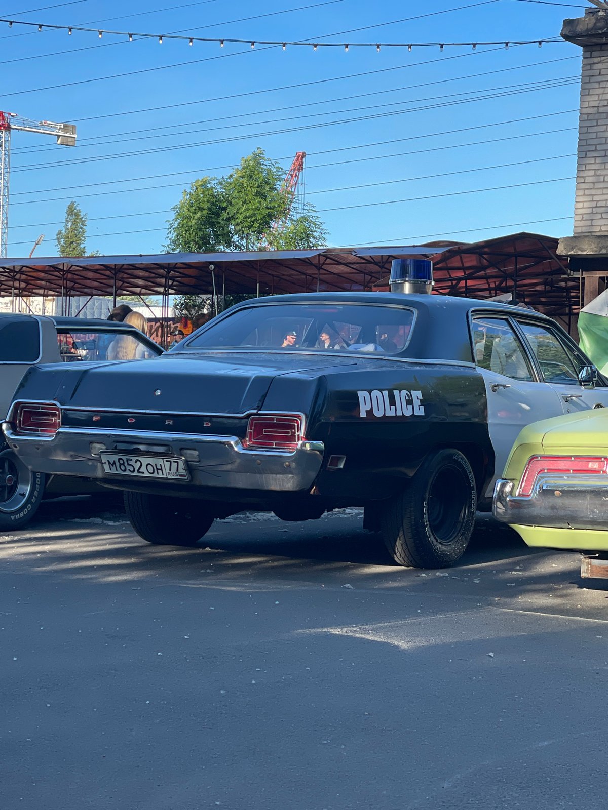 Vintage car meet rolls through Saint Petersburg on a summer afternoon