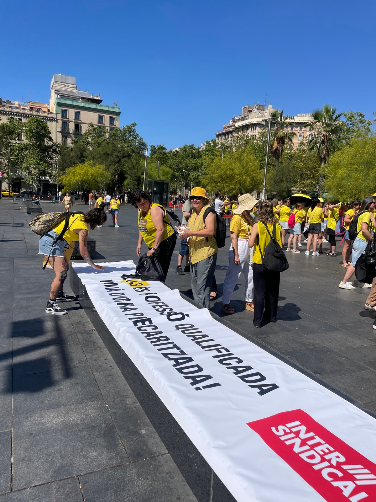 Yellow-clad protesters rally through central Barcelona streets