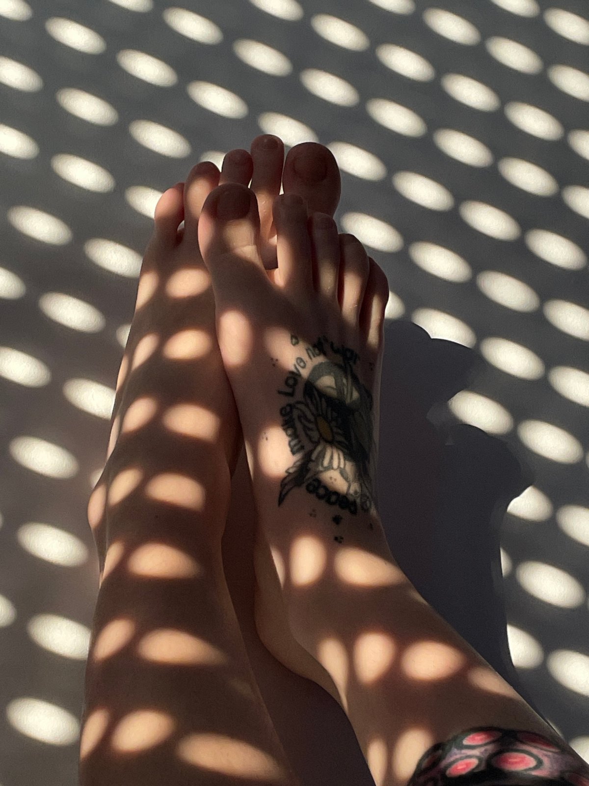 Dappled summer light and bare feet in a Belgrade apartment