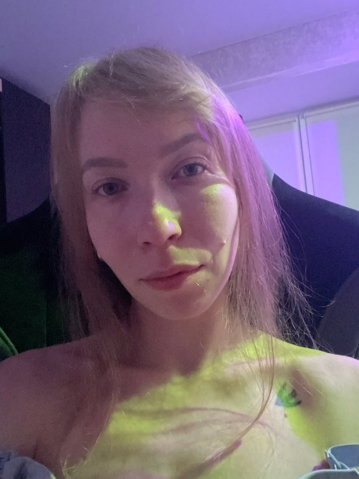 Indoor portraits captured in Perm under colored lighting