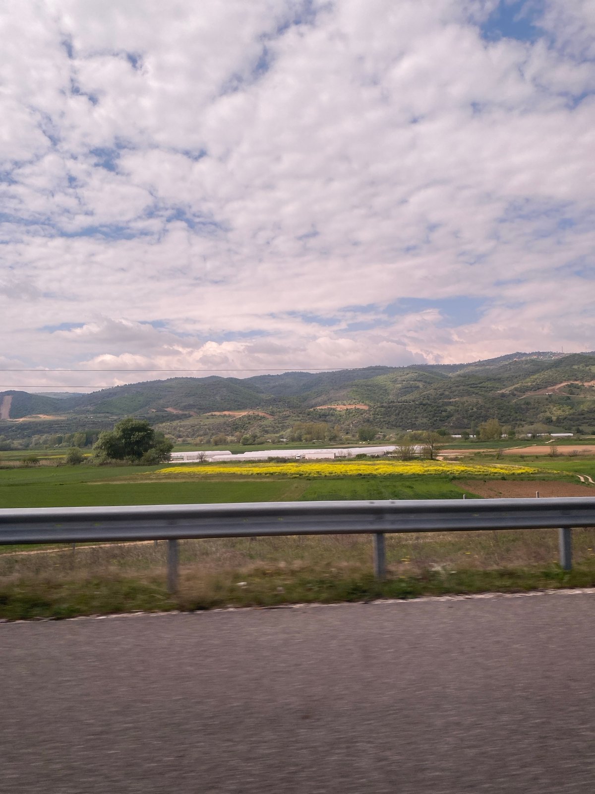 Morning drive through rural Sandanski countryside documented by traveler
