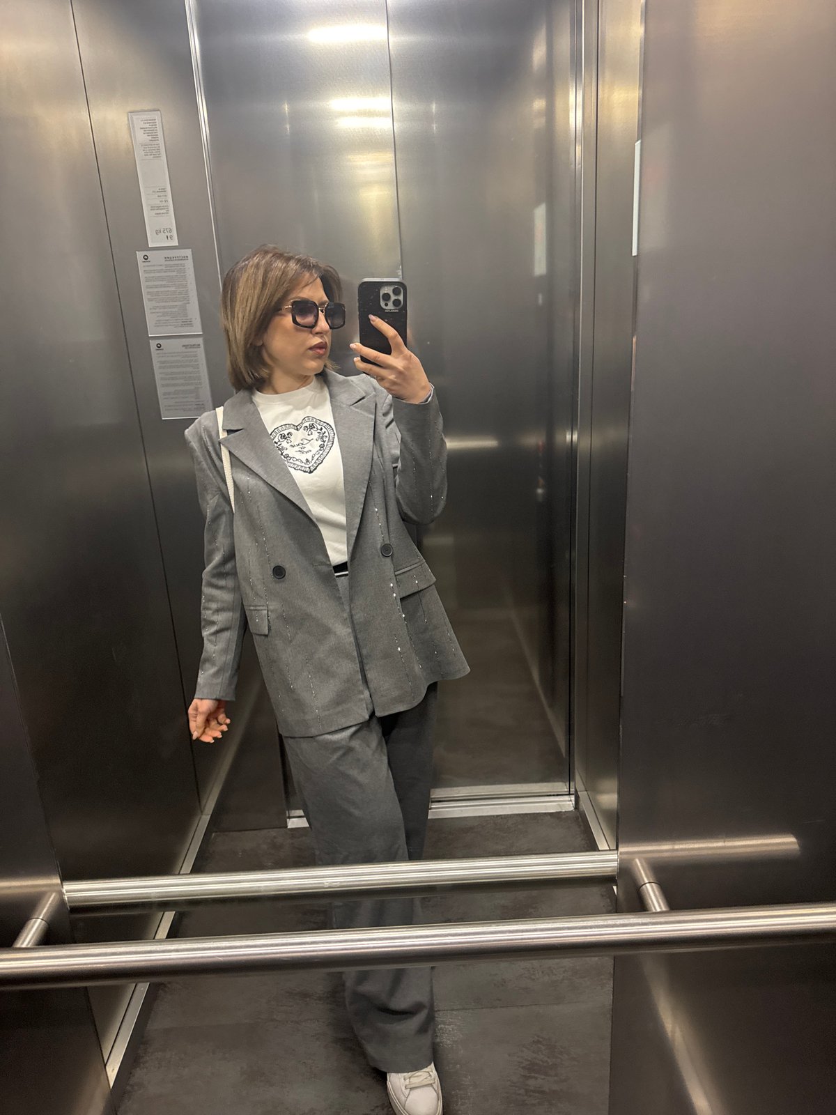 Woman takes elevator selfie in Sofia morning hours