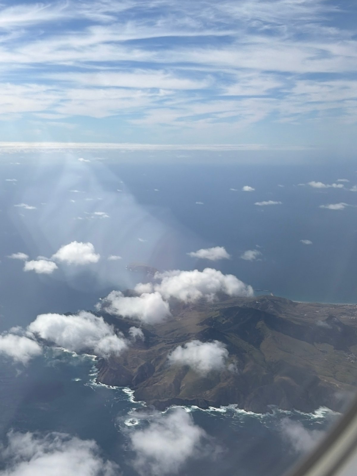 Aerial view captures Porto Moniz's rugged cliffs from aircraft