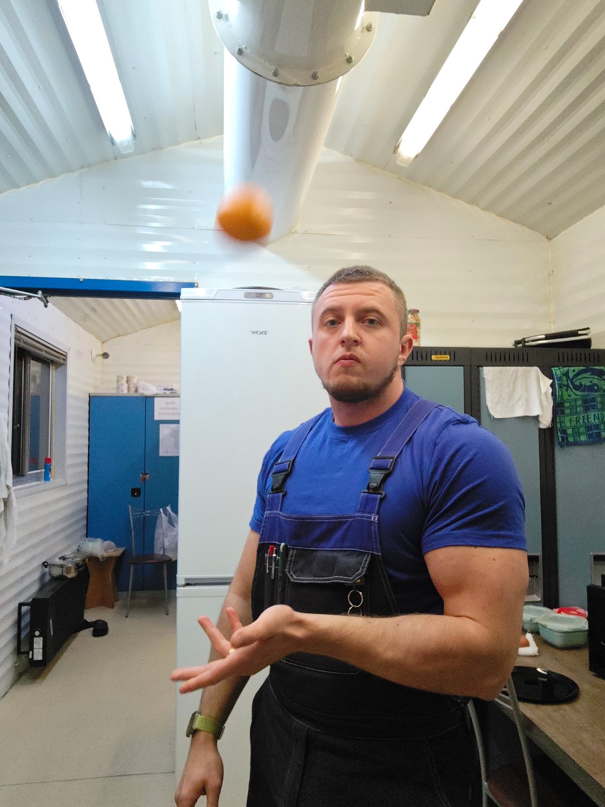 Worker prepares home-cooked meal in Russian kitchen