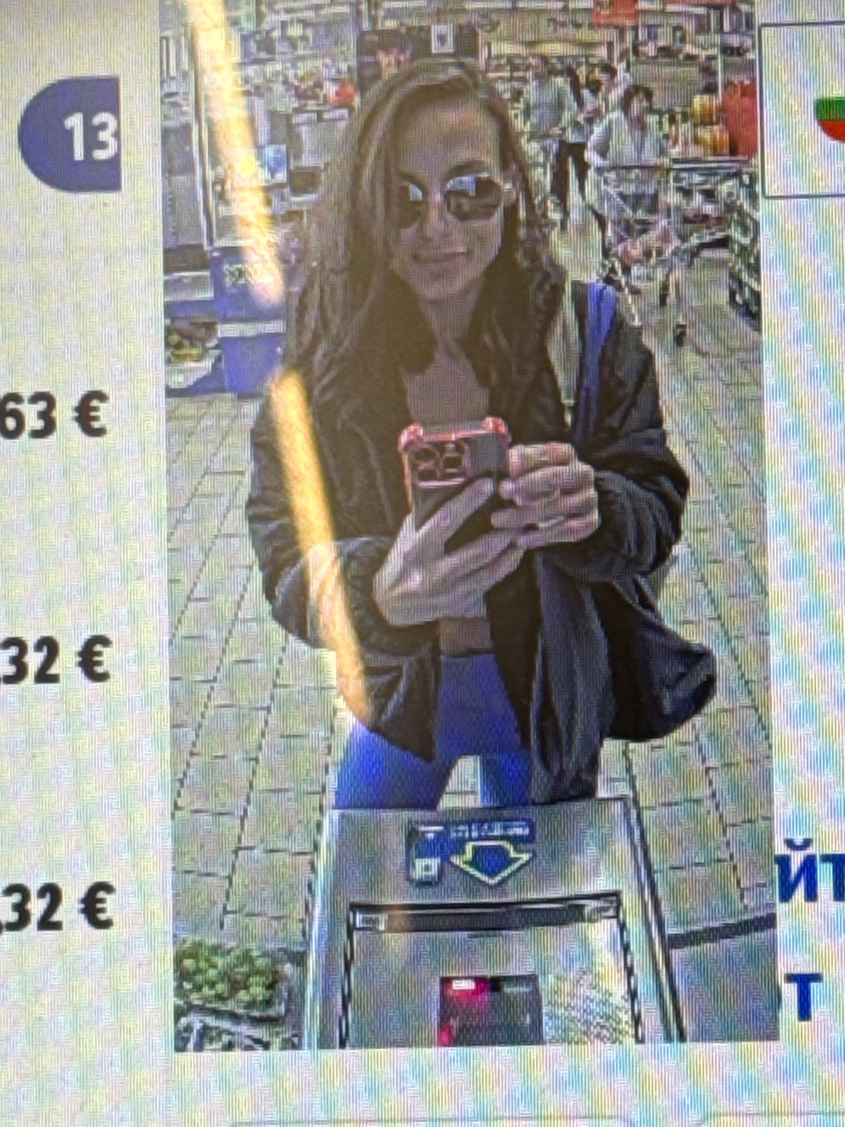 Woman takes selfie near vending machine in Pleven, Bulgaria