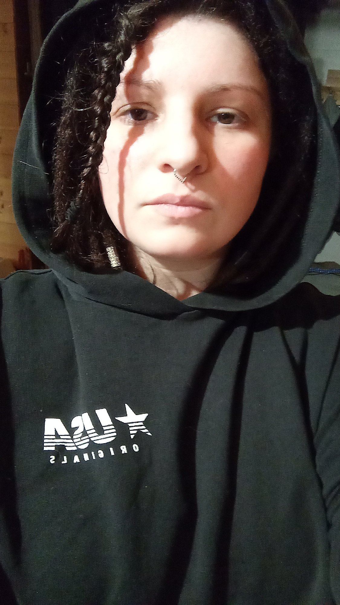 Woman in black hoodie photographed twice in Юдино, Russia