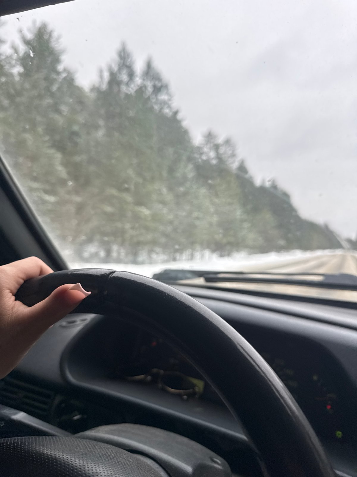 Driver navigates rainy conditions in Chaikovsky, Russia