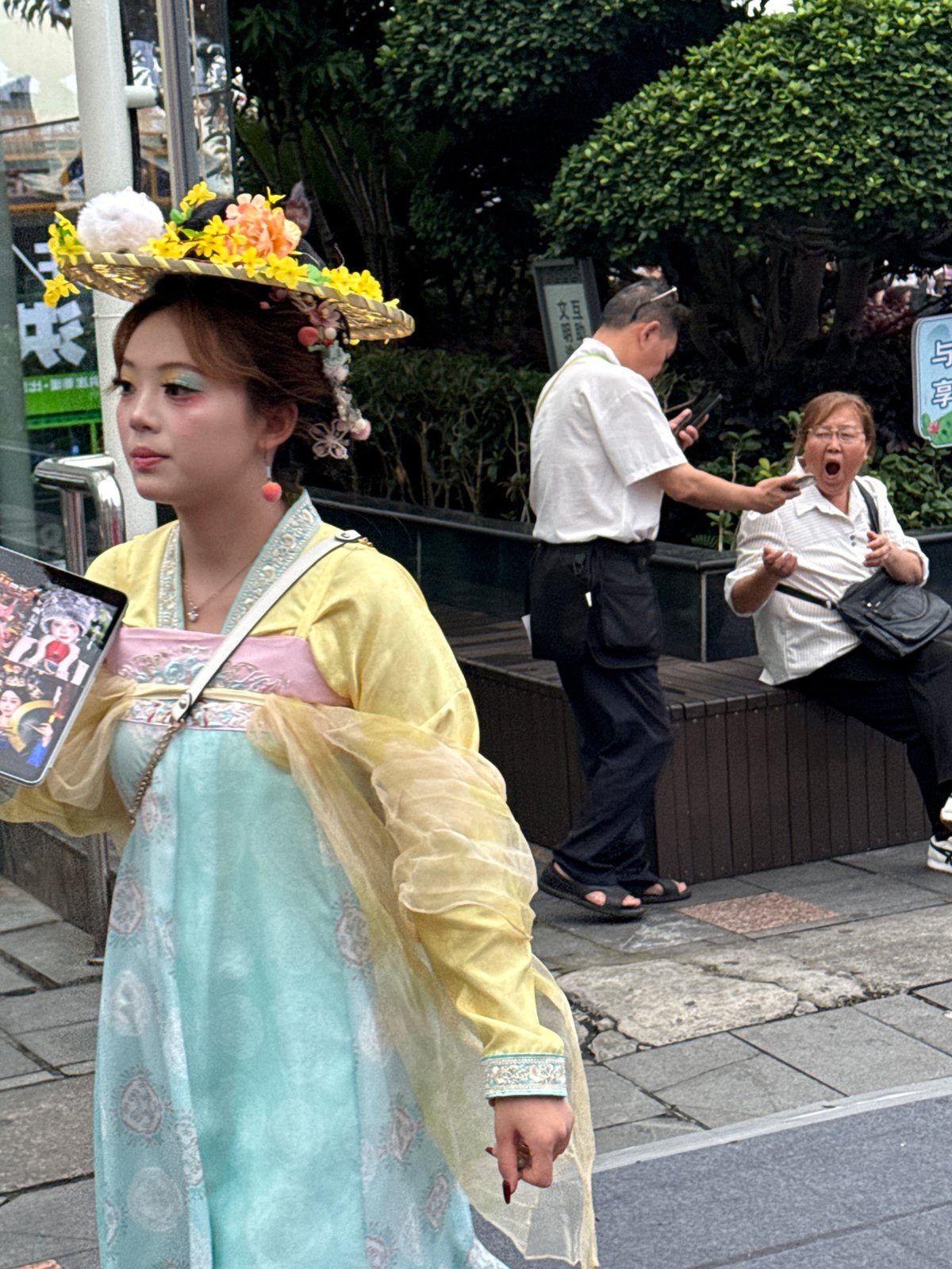 Pedestrians tour bronze sculpture displays in Yuzhong District