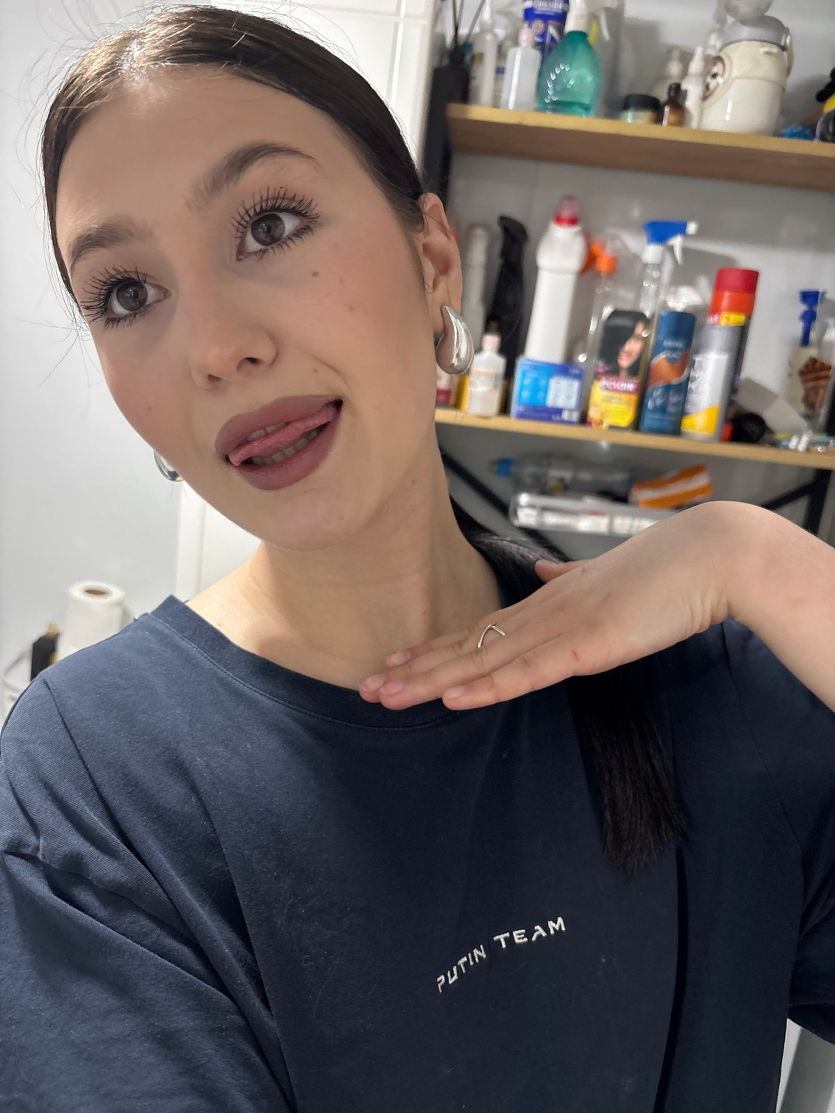 Woman applies makeup in Foki, Russia morning routine