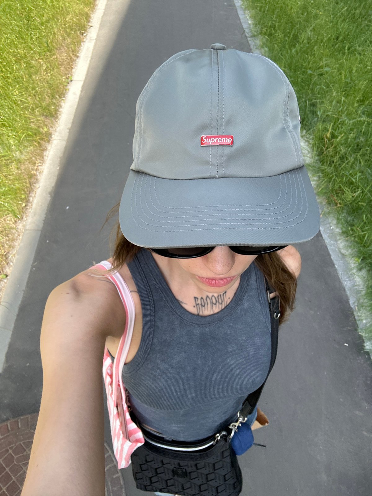 Morning selfies captured near parked motorcycle on Moscow sidewalk