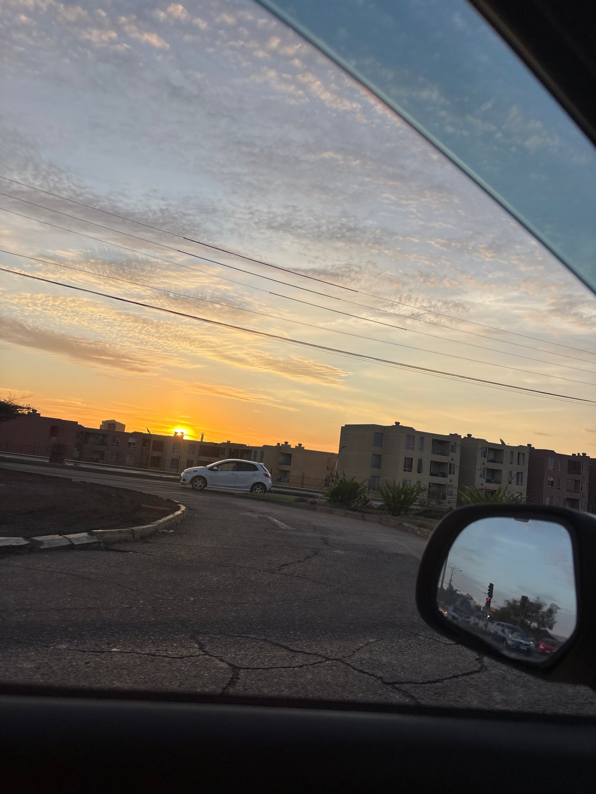 Sunset drive captured through car windows in Arica Chile