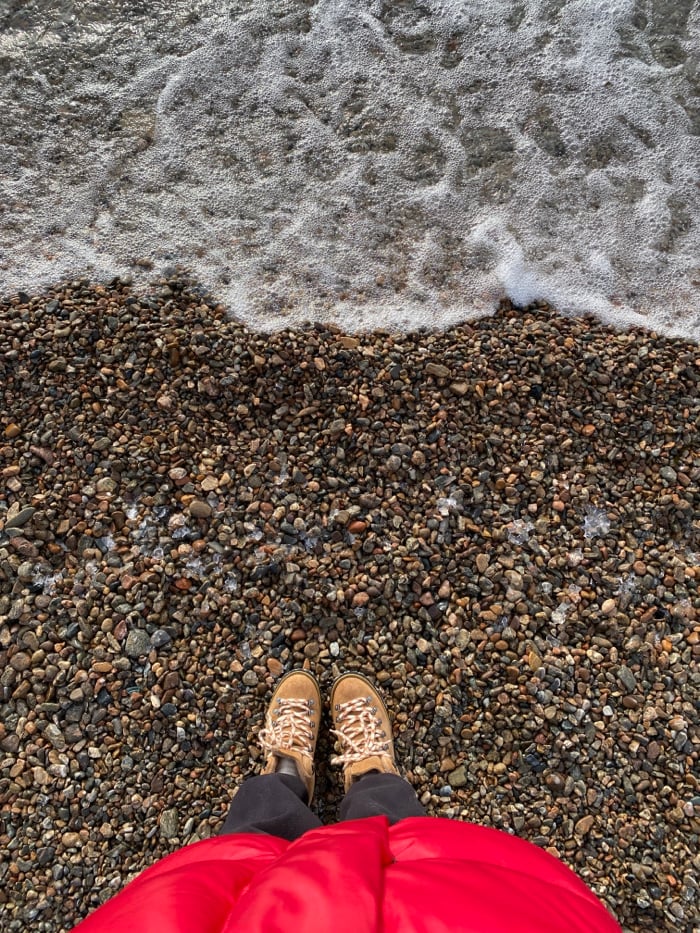Winter visitor explores icy Lake Baikal shore in Listvyanka