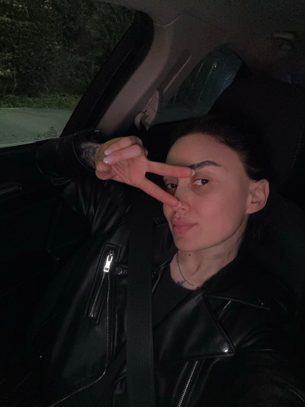 Nighttime car journey documented through selfies and street scenes in Tbilisi