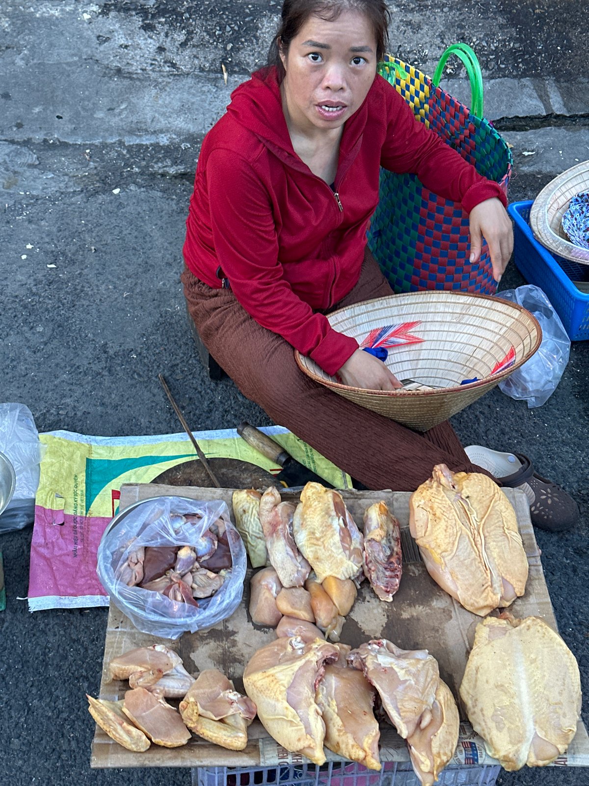 Street market life in Nam Nha Trang, vendors and traffic at dusk