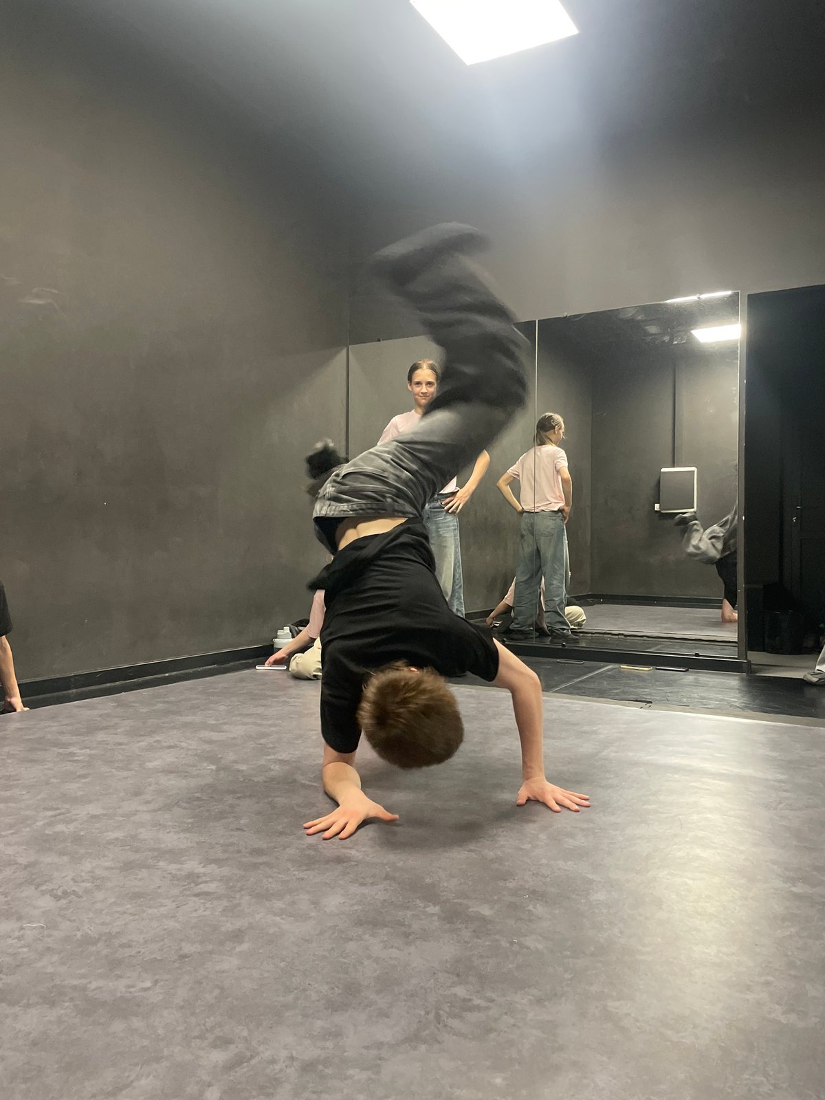 Breakdancers practice acrobatic moves in Krasnoyarsk studio