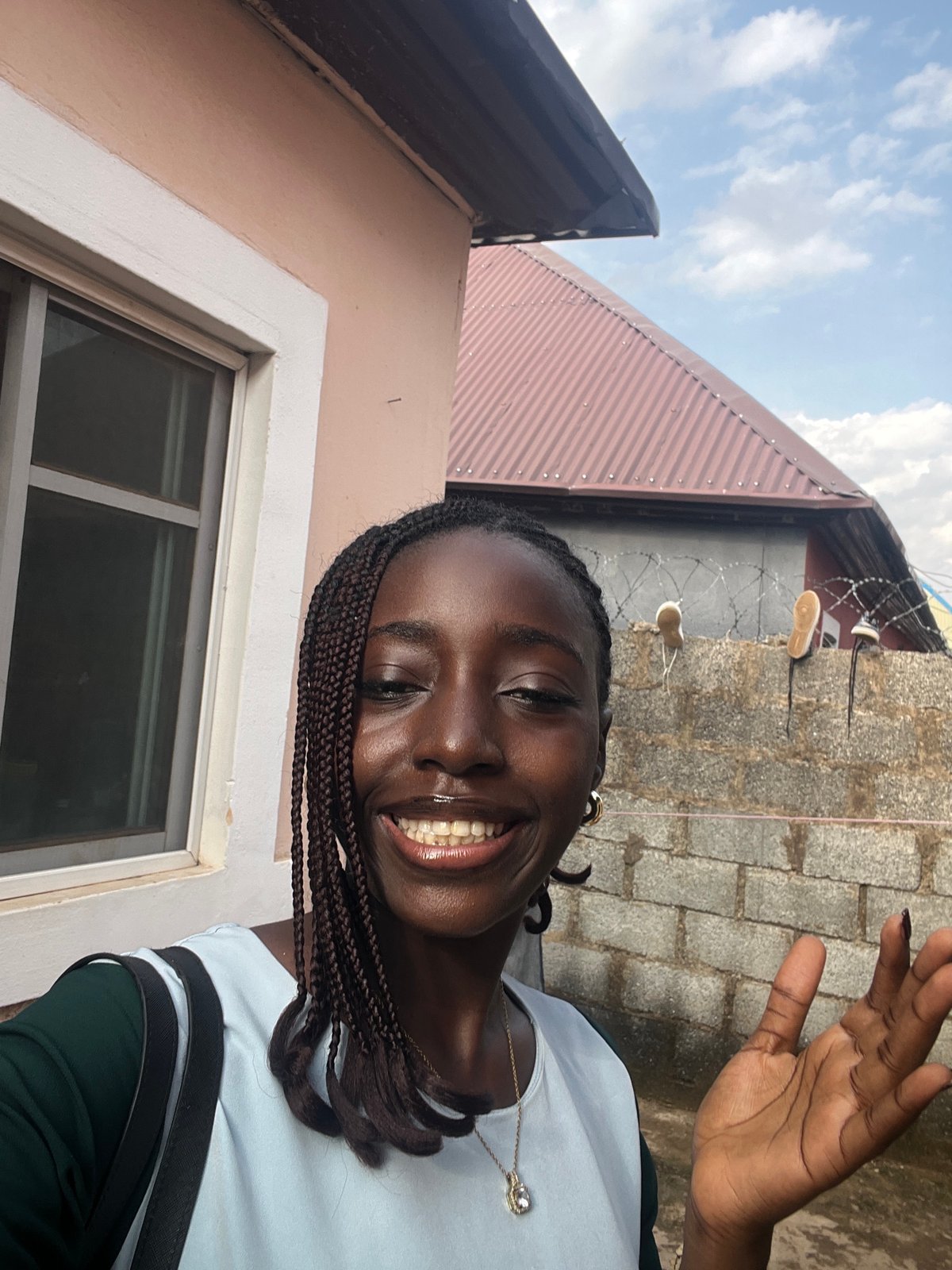 Woman takes selfie photo session in Abuja residential area