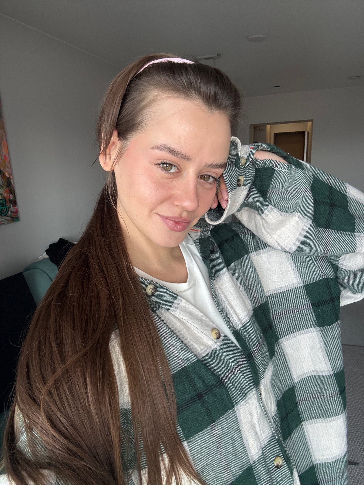 Woman takes morning selfie in Krasnoyarsk apartment
