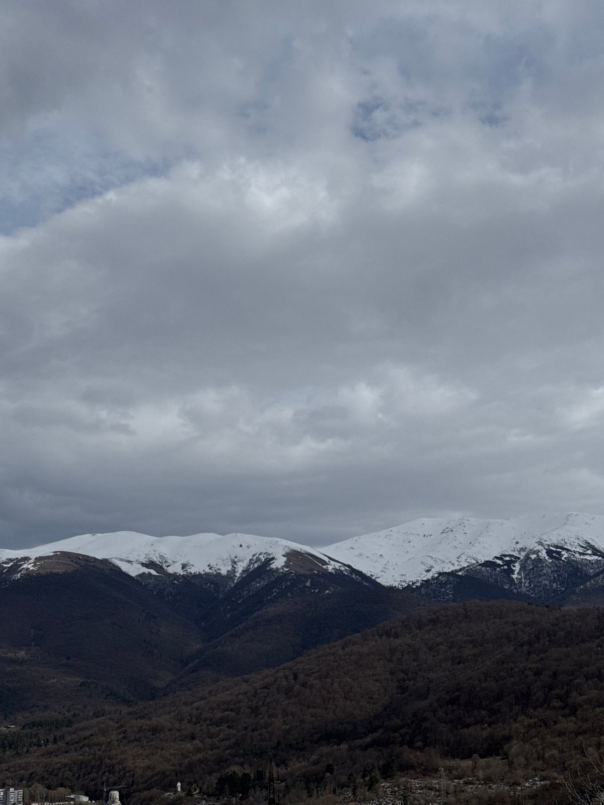 Snow-covered mountains and forests captured in Dilijan, Armenia