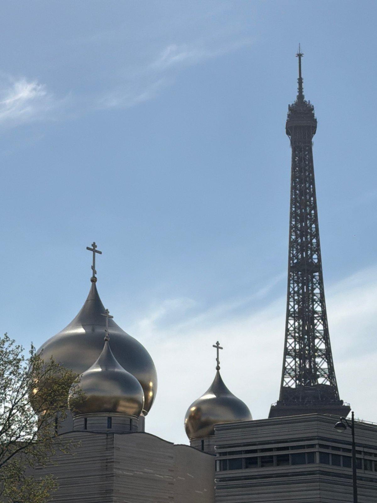 Eiffel Tower viewed with Russian Orthodox Cathedral domes in Paris