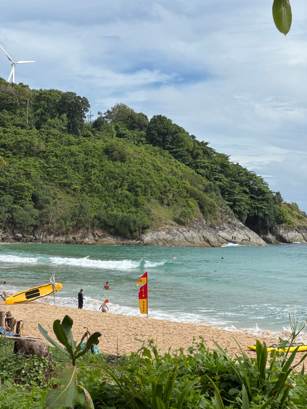 Lazy morning at Rawai beach — coconuts, coast, and a fruit stand