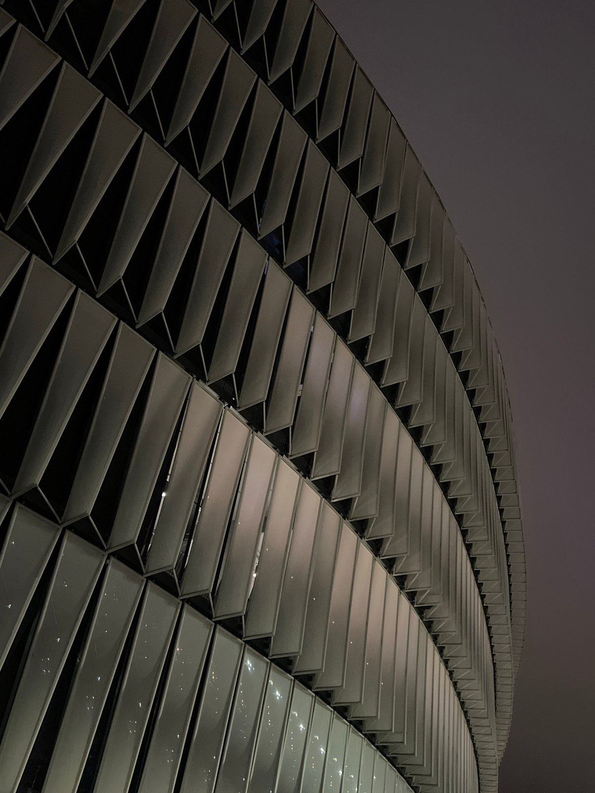 San Mamés Stadium exterior glowing at night in Bilbao