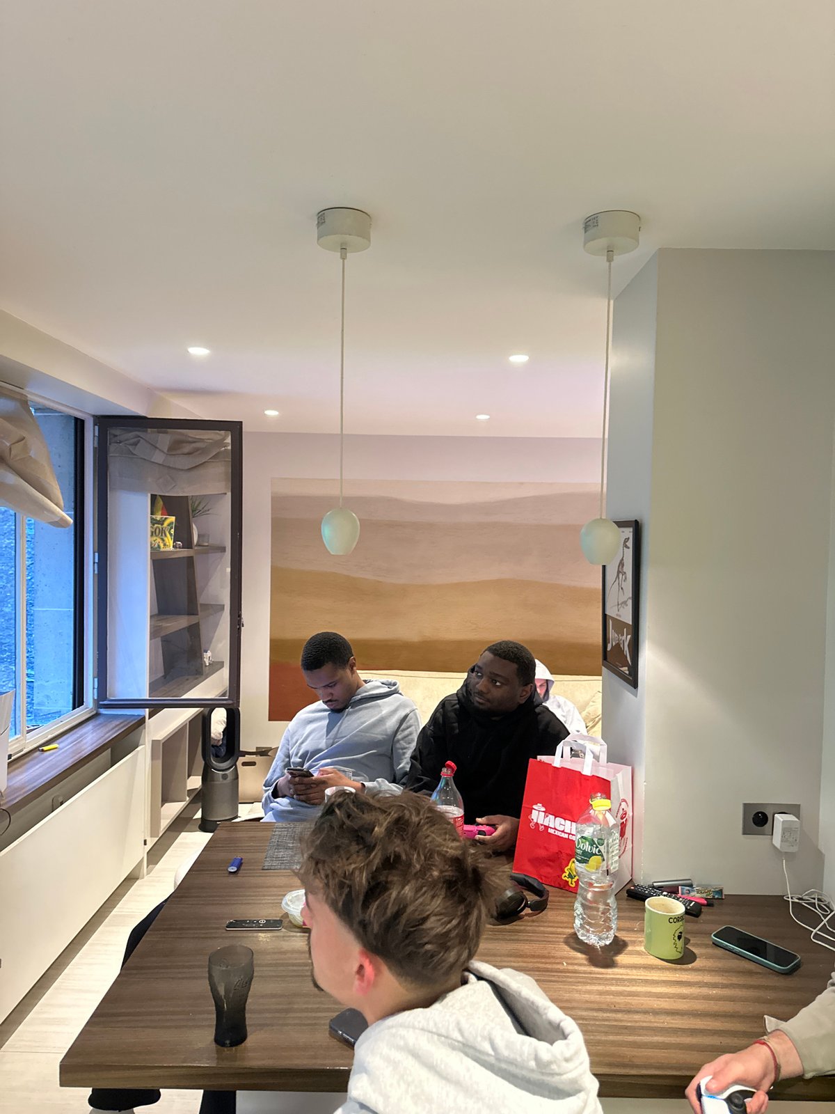 Young men gaming session captured in Neuilly-sur-Seine apartment