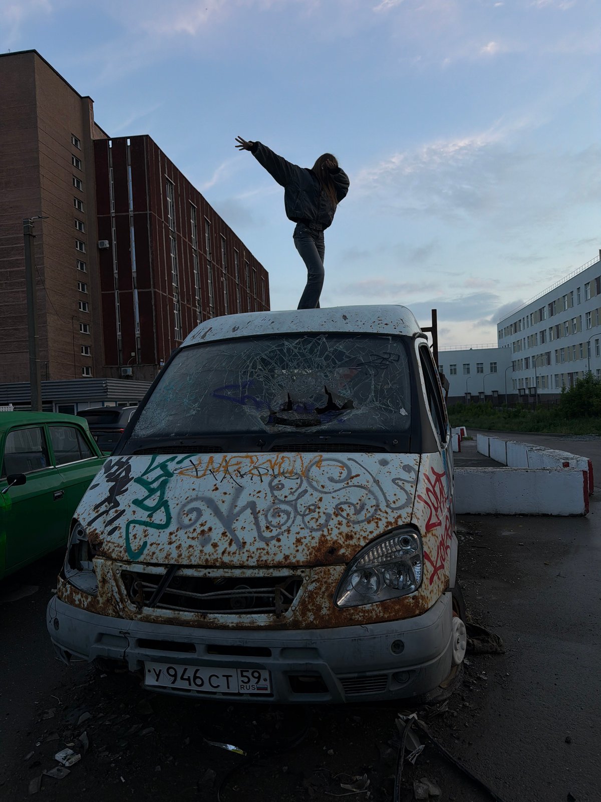 Young people gather around abandoned van in Perm