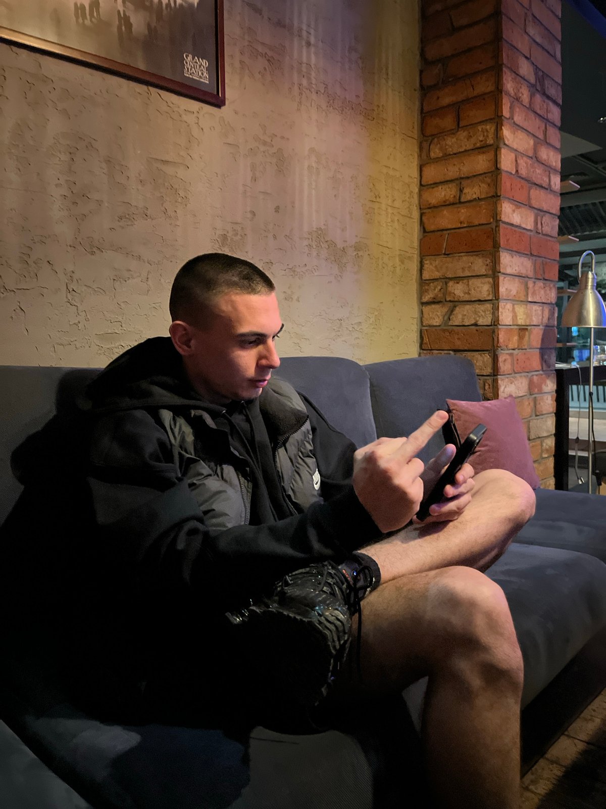 Young people socialize at dimly lit bar in Karlovo