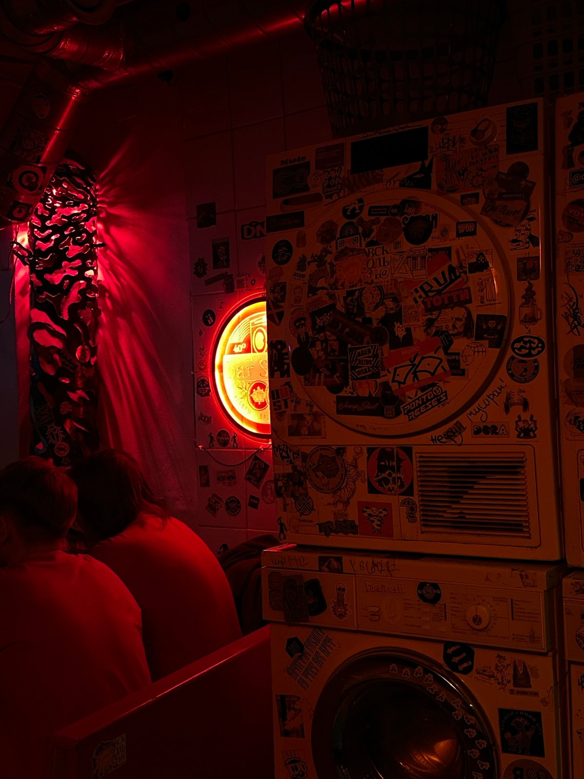 Red-lit bar scene captured in Saint Petersburg evening