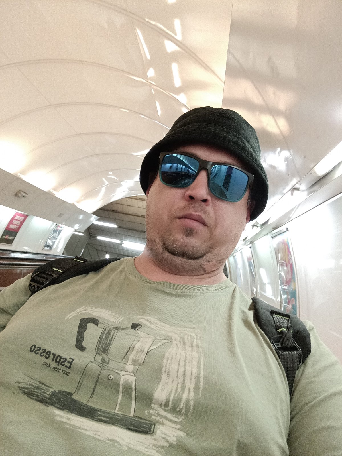 Selfie session on the Prague Metro, espresso tee in frame