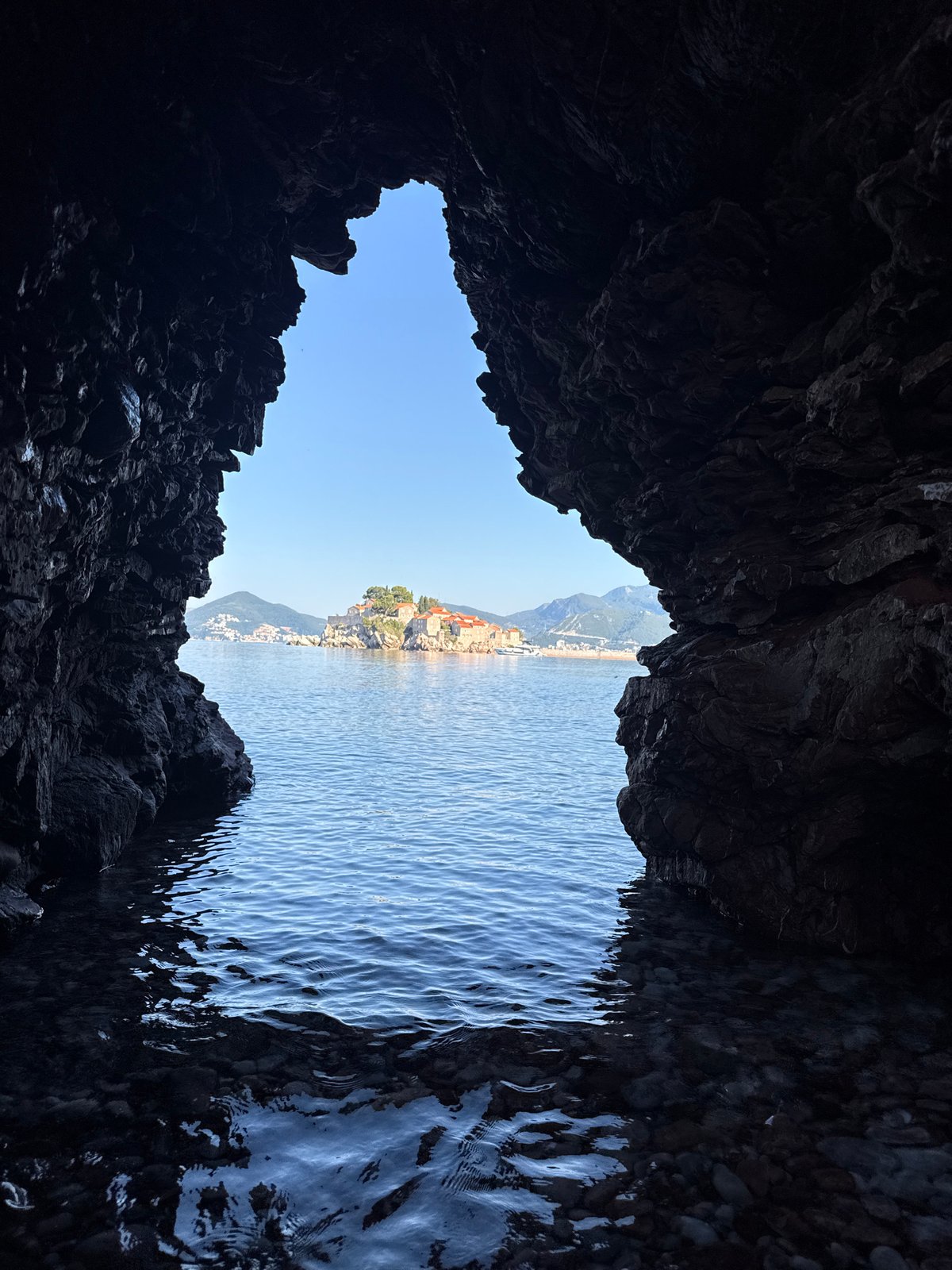 Budva coastline at dawn: caves, arches, and Sveti Stefan views