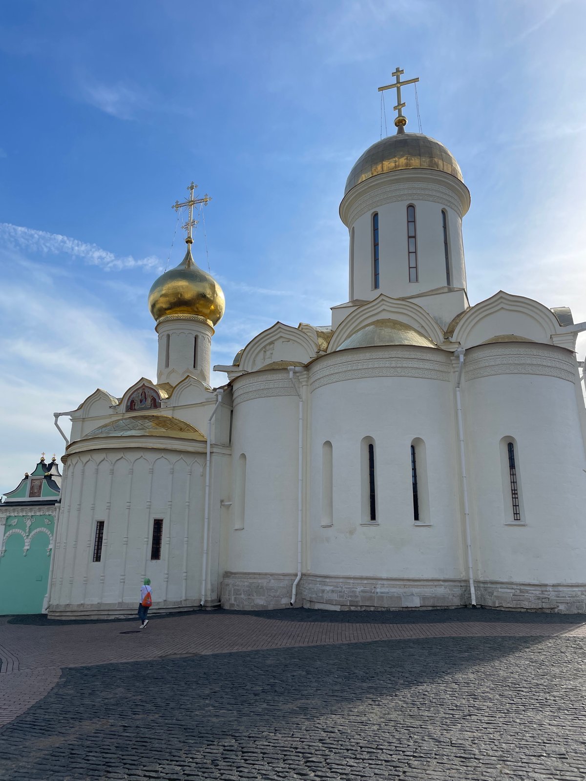 Eastern Orthodox church with gilded domes, ornate exterior detailing.