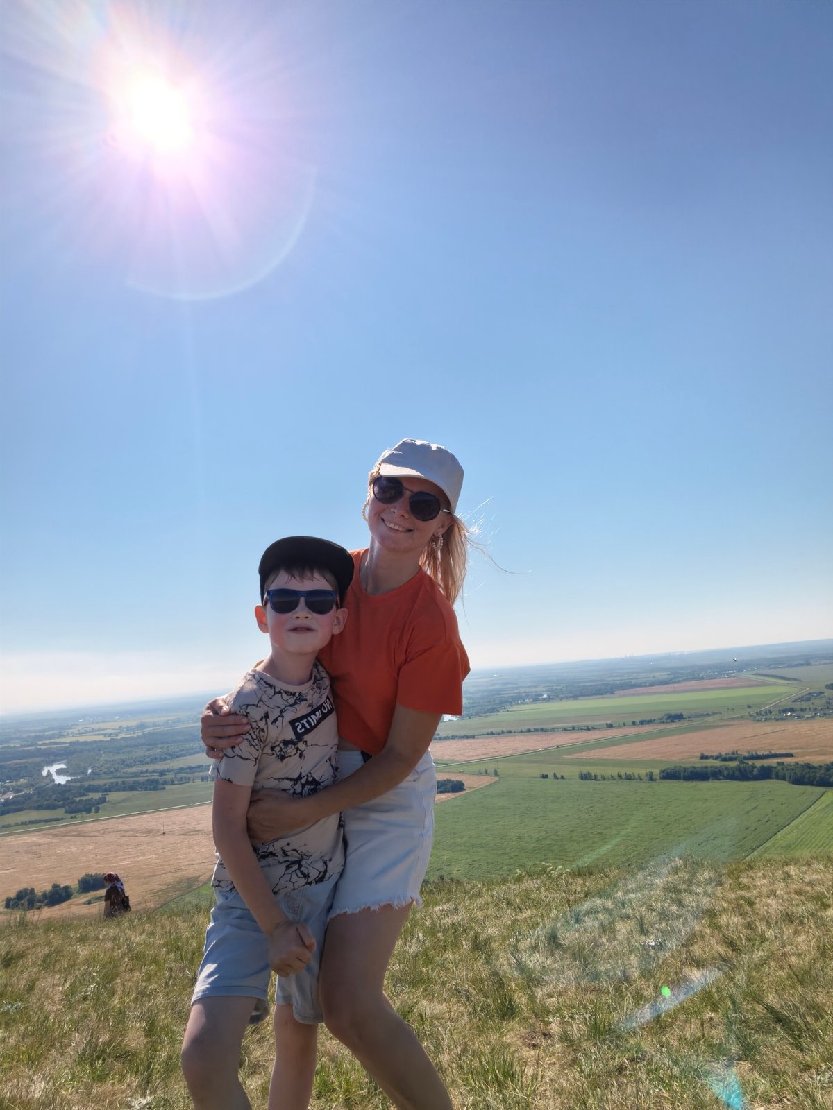 Sunny day at Shikhan hilltop with panoramic views and paragliding