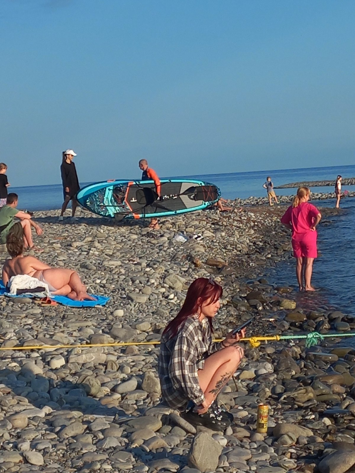 Beach activities observed in Sochi during summer afternoon