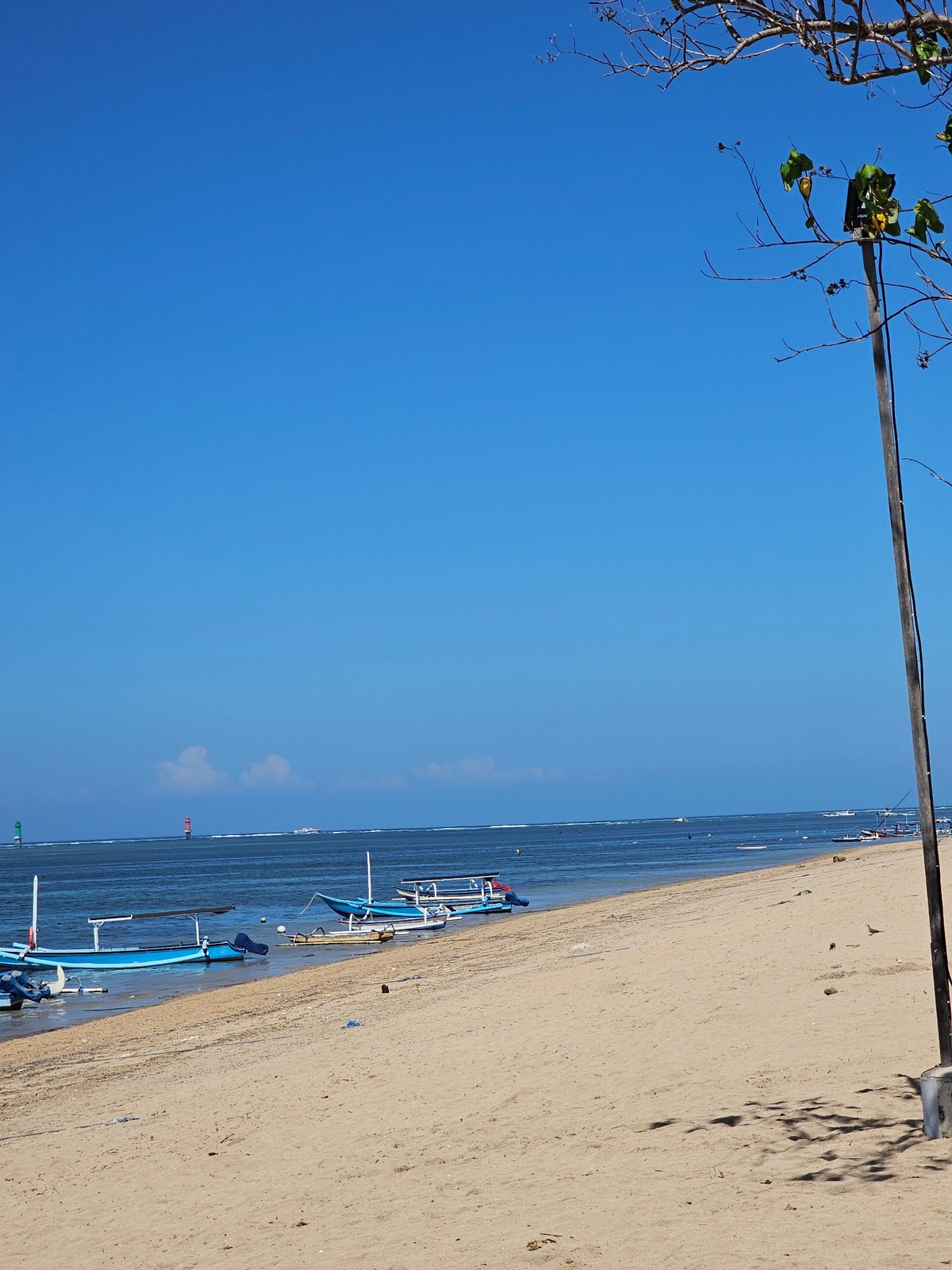 Sanur Beach on a busy Bali morning — sun, sand, and street life
