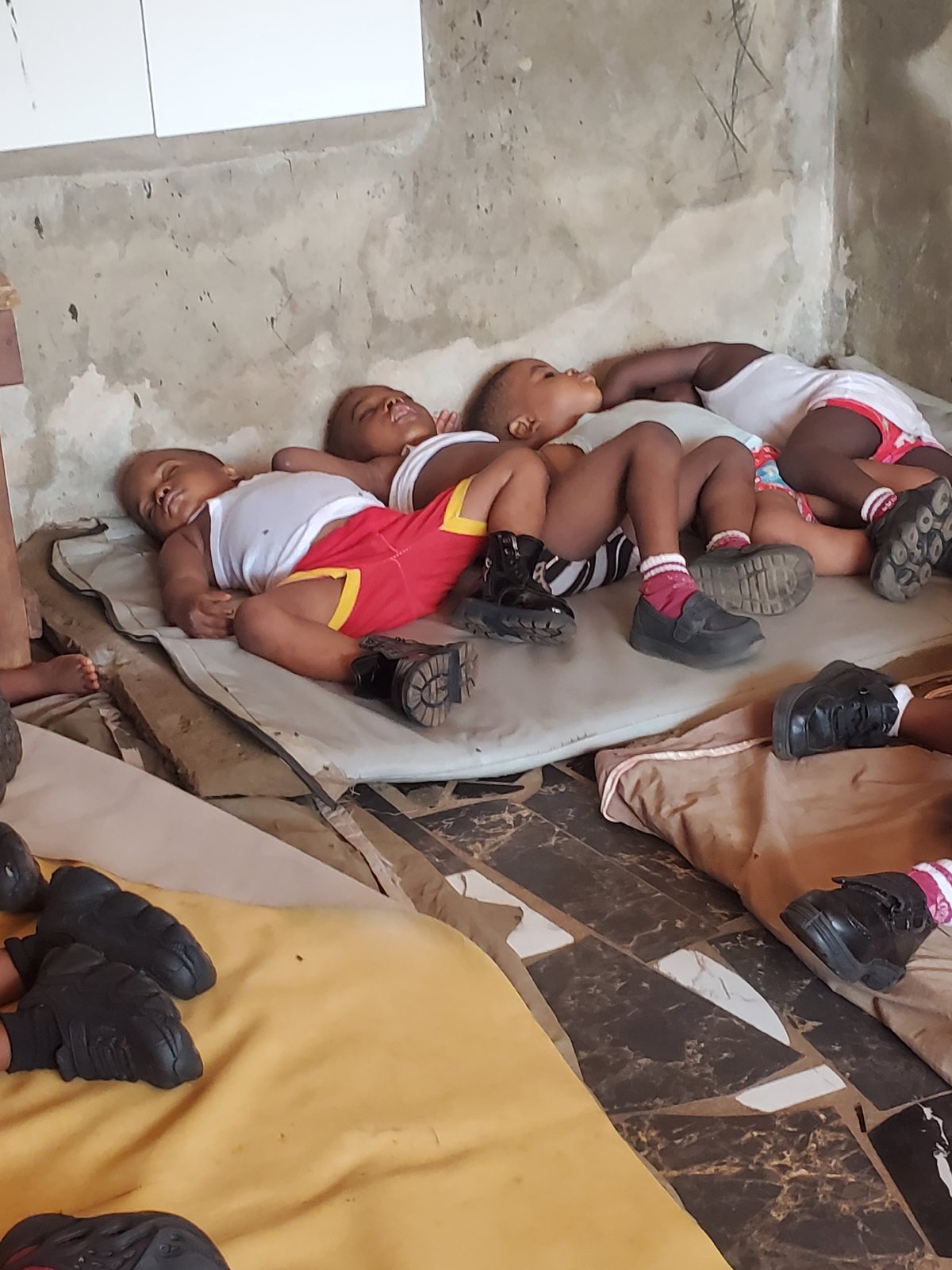 Children rest during midday in Nigerian schools and homes