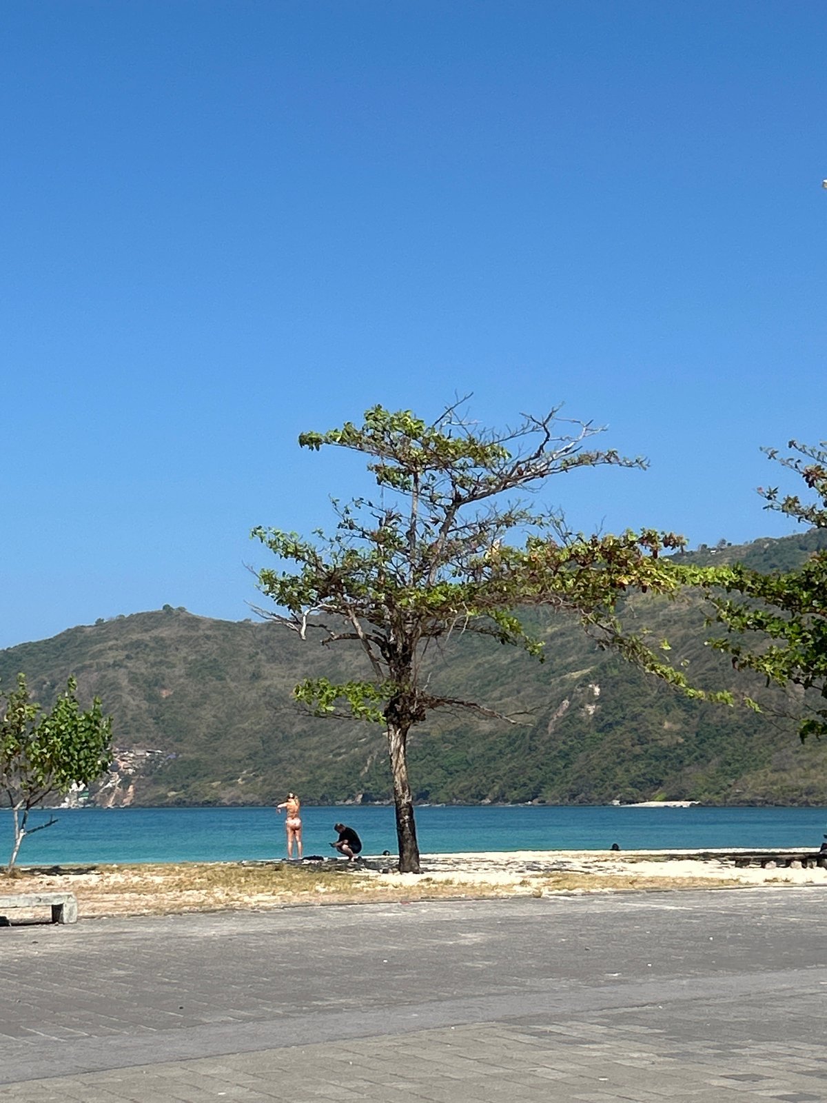 A sunny morning along Kuta Lombok's beach and promenade