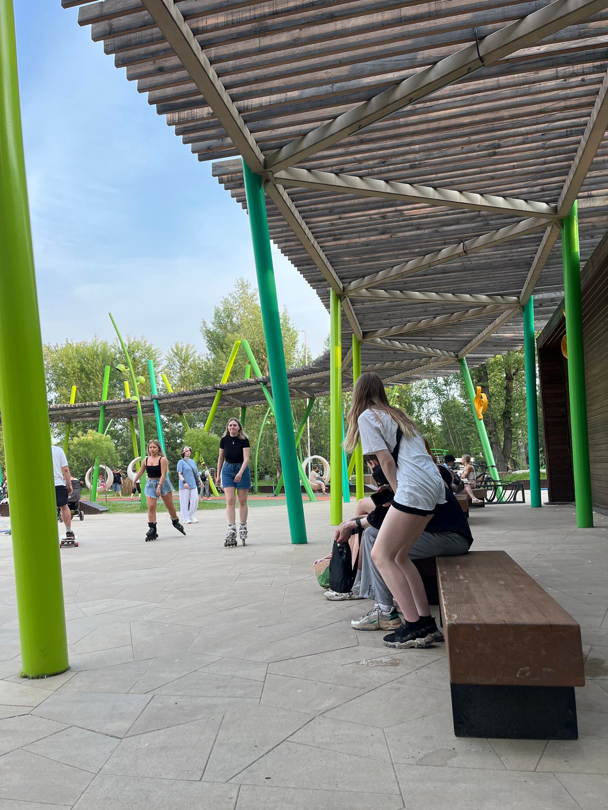 Summer afternoon at Krasnoyarsk playground with skating and family activities