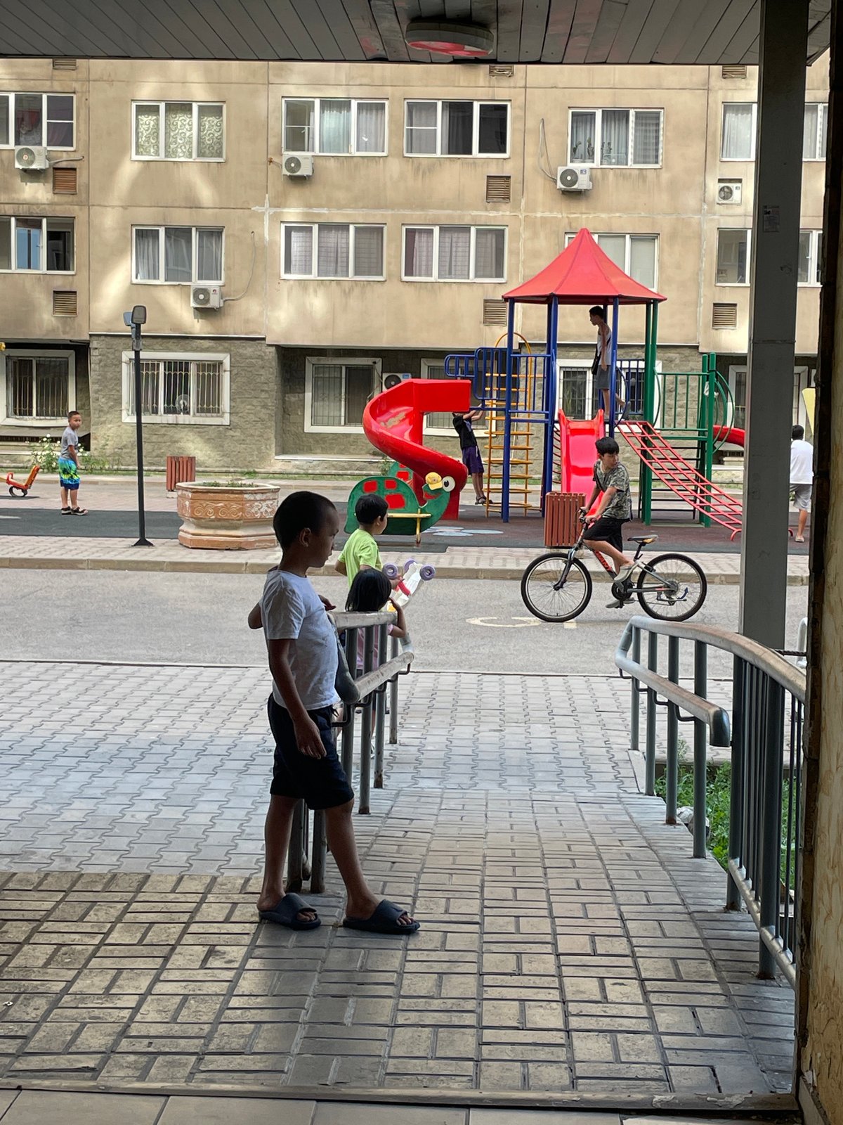 Quiet Almaty neighborhood buzzing with ordinary morning activity