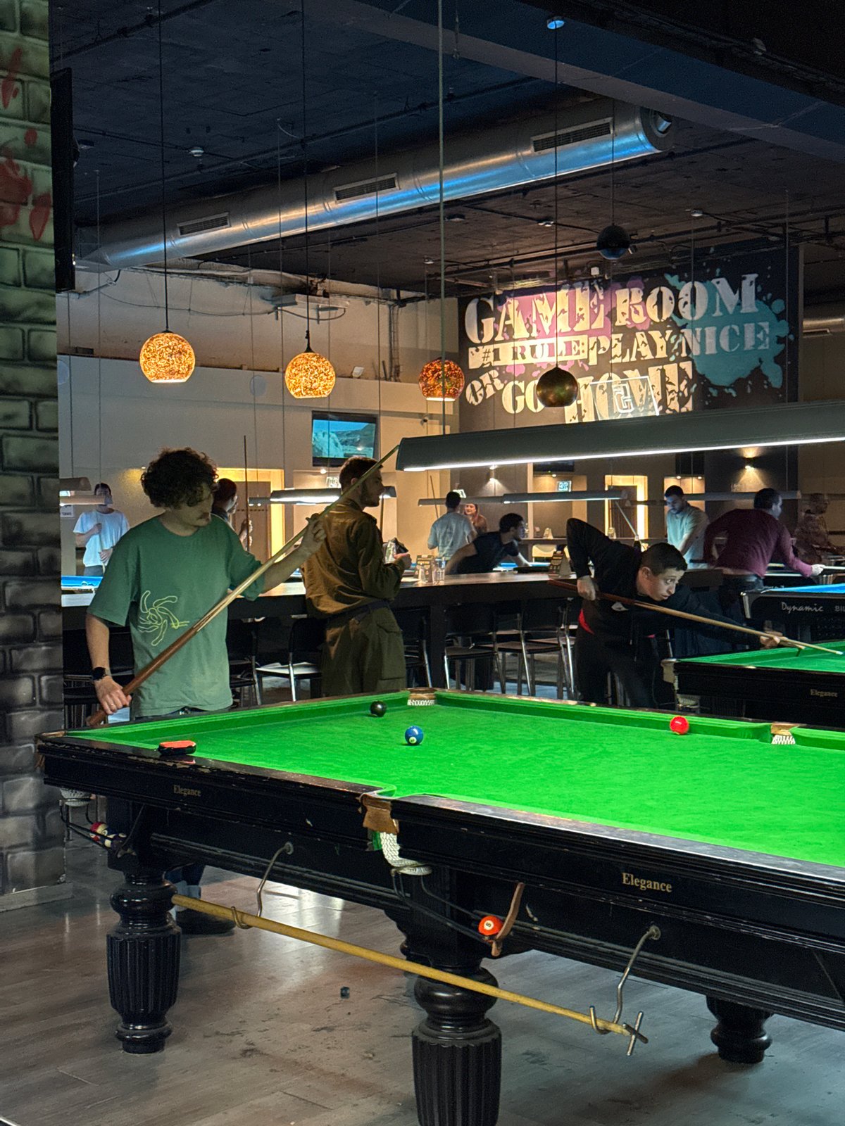 Pool game in progress at Tel Aviv game room