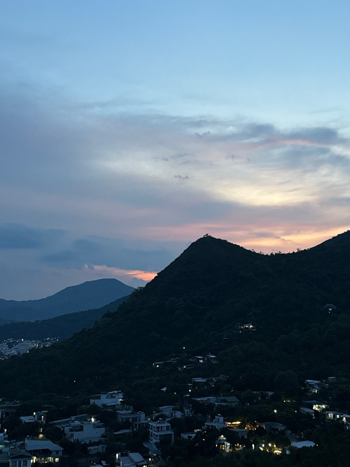 Sunset sweeps over Nha Trang's green hills and coastal sprawl