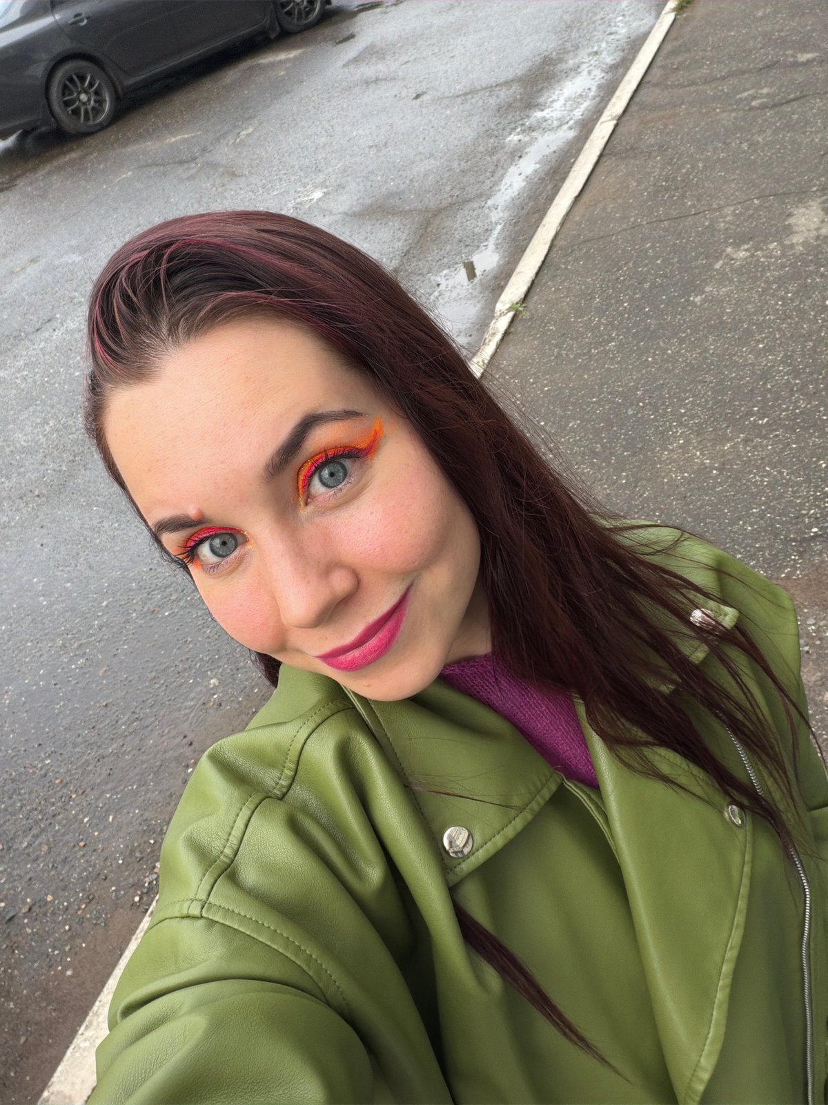 Outdoor selfie with bold makeup and colorful style in Chaikovsky