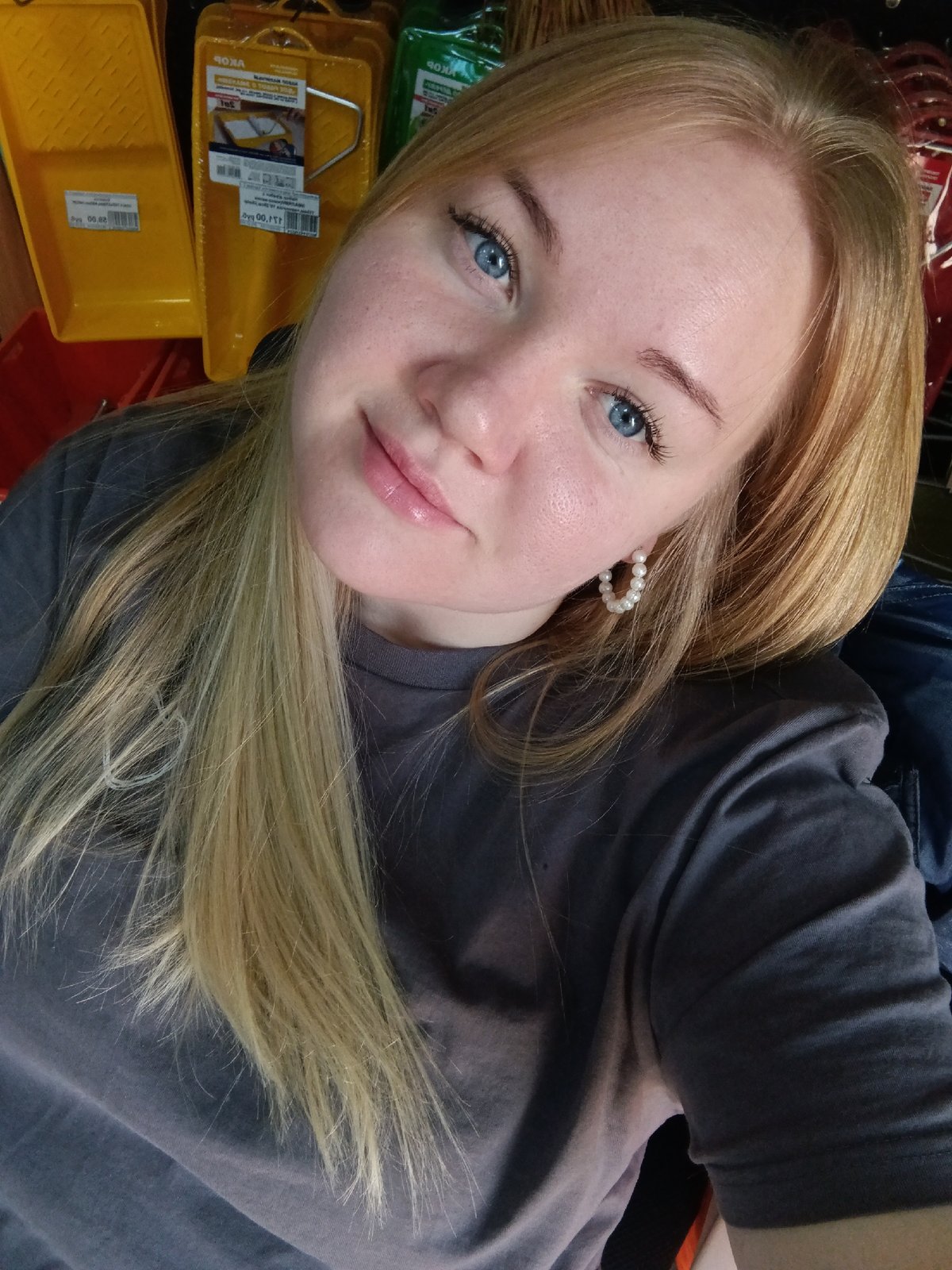 Woman takes selfie in art supply store