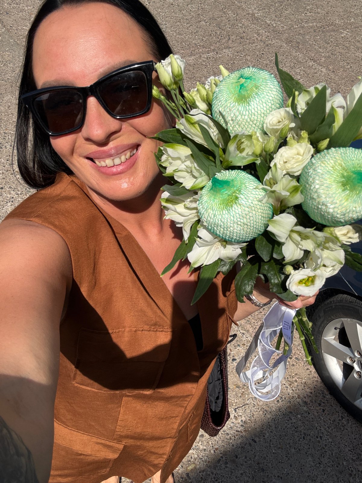 Morning out in Chaikovsky with a bouquet of white flowers