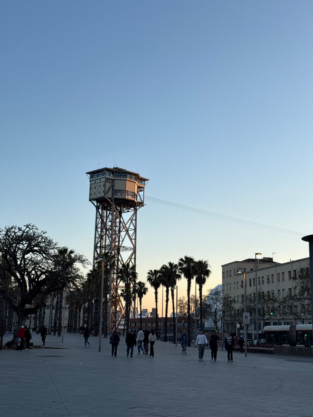 Barcelona waterfront bustling with sunset beach activities