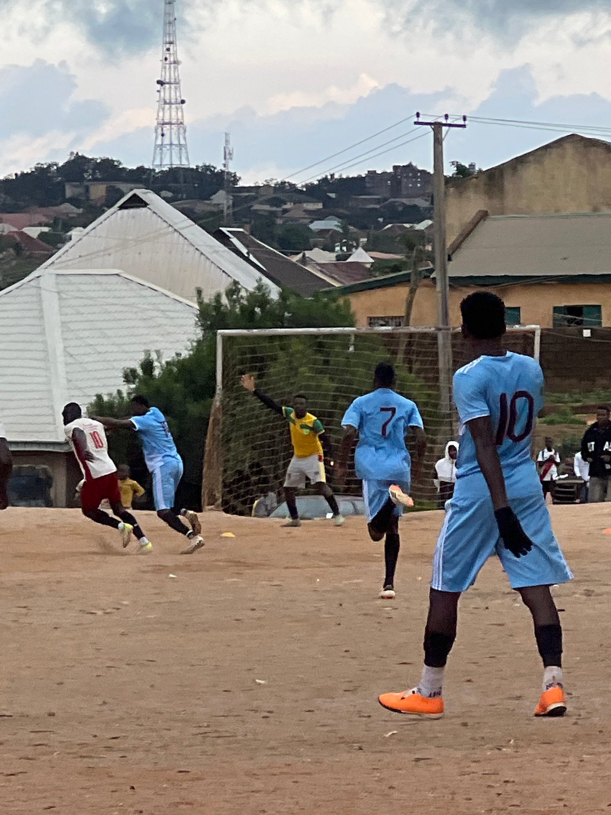 Afternoon football on a dirt pitch in Jos, Nigeria