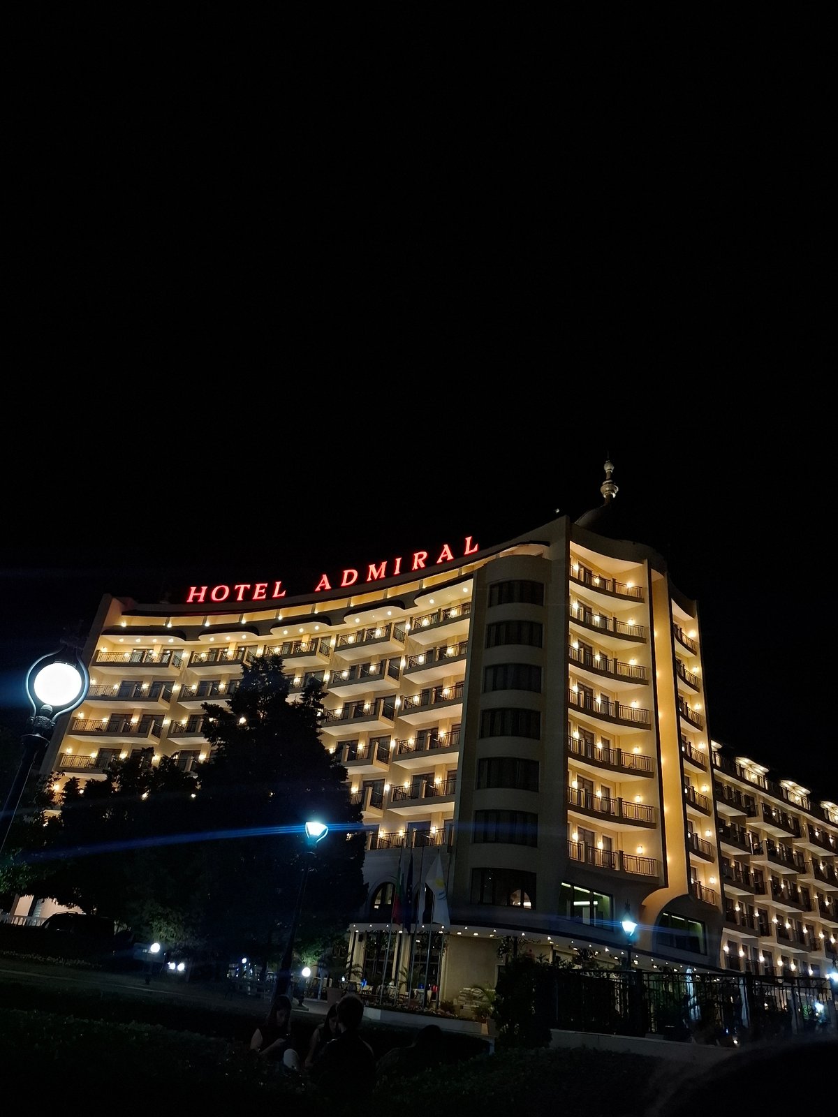 Hotel Admiral glows along Varna's Black Sea waterfront at night.