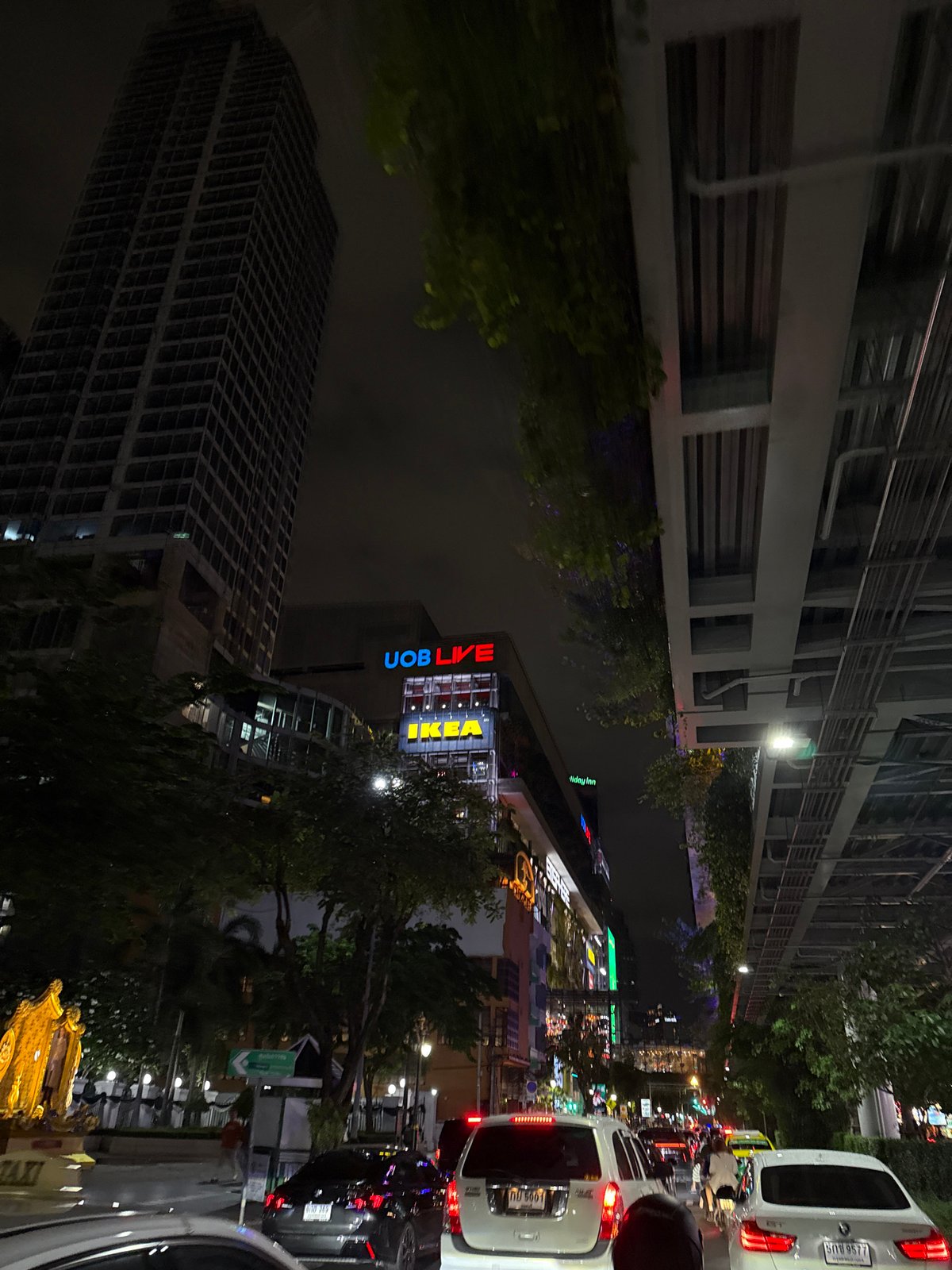 Ground-level nighttime street scene in central Bangkok